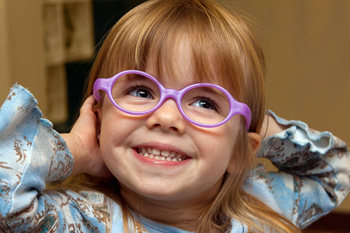 VisualEyes Optometrists - Kid wearing glasses